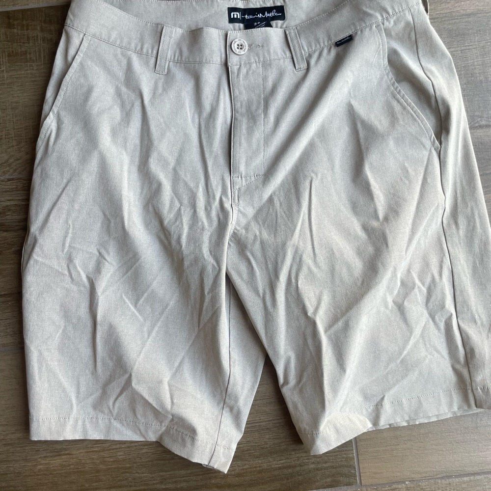 Travis Mathew tan golf shorts